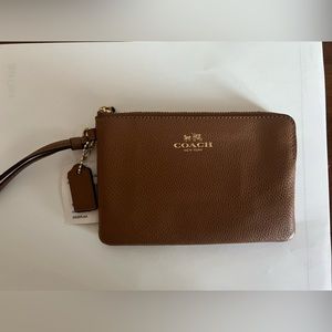 New Coach wristlet wallet. Brown leather. Never been used.